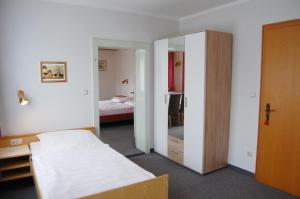 Postel nebo postele na pokoji v ubytování Gästehaus Fidelis