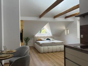 a bedroom with a bed and a window at Apartma Lavanda in Zavrč +12 photos