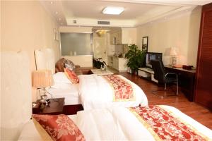 Cama o camas de una habitación en Guangzhou Boman Apartment Zhengjia Huanshi Branch