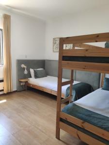 Cama ou camas em um quarto em Old Village Hostel