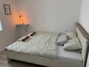 a bedroom with a bed with a lamp on it at House9 in Kotor