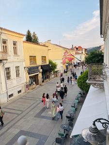a group of people walking down a street at TASY Guest House - Luxury Rooms in the Heart od SHIROK SOKAK in Bitola