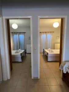 Postel nebo postele na pokoji v ubytování Bloom Garden Apartment