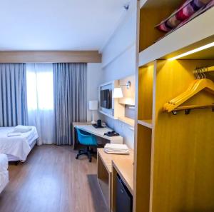 Stay Inn Santos Sua acomodação com cara de Hotel客房内的一张或多张床位