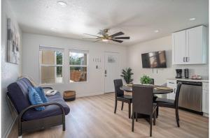a kitchen and dining room with a table and chairs at Historic Comfort 2BR1BA Guesthouse Near Riverwalk in San Antonio
