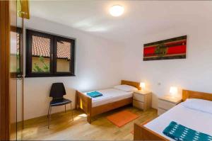 Postel nebo postele na pokoji v ubytování Apartment in Novi Vinodolski 39131