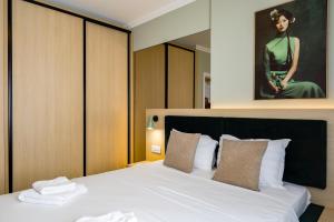 Ένα ή περισσότερα κρεβάτια σε δωμάτιο στο Apartment WIN 52