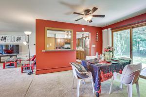 a living room with a dining room table with a ceiling fan at Private 5-Acre Lake Pet-Friendly Grove City Home in Grove City