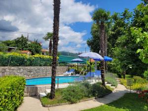 Bazén v ubytovaní Holiday home in Lovran 15113 alebo v jeho blízkosti