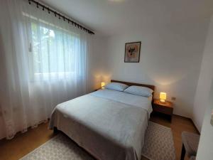 Posteľ alebo postele v izbe v ubytovaní Holiday home in Lovran 15113 + 37 fotografií