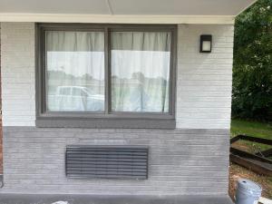 a window on the side of a house at Sun N Sand Motel in Spartanburg