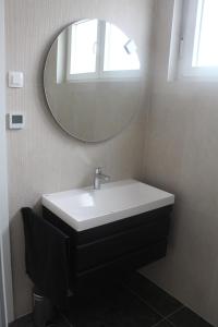 a bathroom with a sink and a mirror at Wiki in Vodice