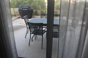 a table and chairs sitting on a patio at Wiki in Vodice