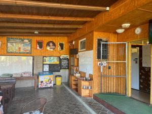 a classroom in a school building with a door open at Autocamp Free Star - Chatky a Bungalovy in Strachotín