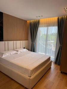 Postel nebo postele na pokoji v ubytování Hotel Qetesia-Te Indriti