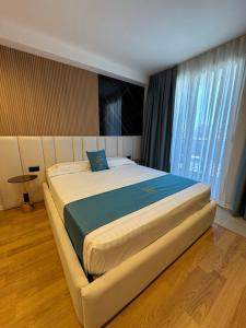 Postel nebo postele na pokoji v ubytování Hotel Qetesia-Te Indriti