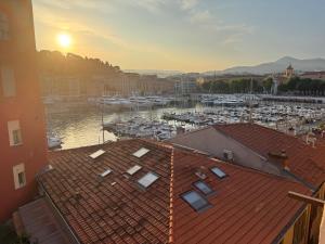 a view of a harbor with boats in the water at Nice Port, French Riviera in Nice