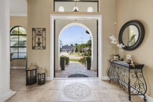an entryway with an open door to a driveway at Villa Pearl in Cape Coral +45 photos