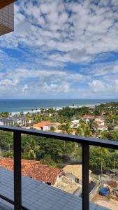 a view of the ocean from the balcony of a house at Studio em Salvador- Vista Mar in Salvador