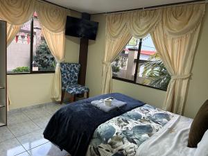 Postel nebo postele na pokoji v ubytování Hotel Casa Santa Lucía