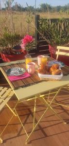 a table with food and drinks on top of it at Les bonbonnettes in Le Cailar