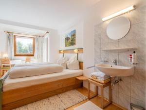 A bed or beds in a room at Schleicherhof V