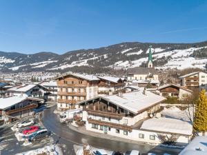 a town in the snow with a mountain in the background at Gaisberg Alpin in Kirchberg in Tirol