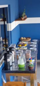 a counter in a kitchen with some food on it at Praieira Pousada in Itacaré