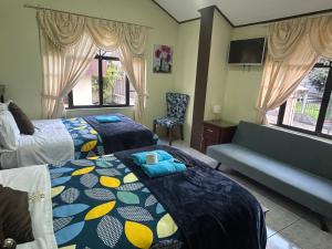 Postel nebo postele na pokoji v ubytování Hotel Casa Santa Lucía