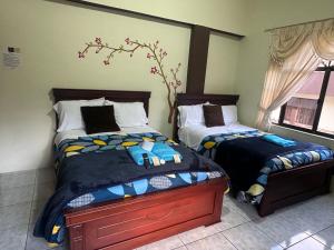 Postel nebo postele na pokoji v ubytování Hotel Casa Santa Lucía