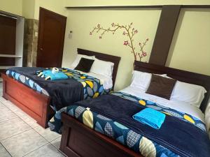 Postel nebo postele na pokoji v ubytování Hotel Casa Santa Lucía