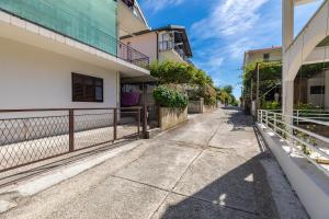 an empty street in front of some buildings at Studio Podaca 516a in Podaca +9 photos