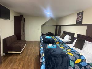 Postel nebo postele na pokoji v ubytování Hotel Casa Santa Lucía