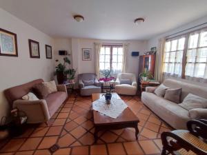 a living room with couches and a coffee table at Hostal Normandie in Pamplona