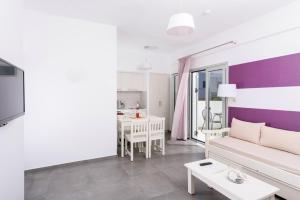 a living room with a couch and a table at Angela Studios Apartments in Sissi