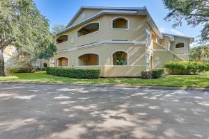 a large white house with a driveway at Saltwater Pool and 4 Mi to Beach Clearwater Condo! in Clearwater