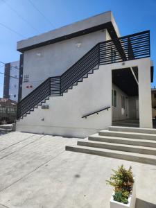 a building with stairs on the side of it at San Marino guest house in Los Angeles