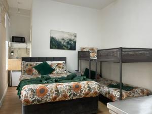 a bedroom with two bunk beds in a room at Ariana House Hotel-Families and Couples Only in Blackpool