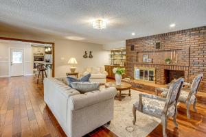 a living room with a couch and a fireplace at Gated 35-Acre De Soto Estate Pool, Lake and Patio! in De Soto