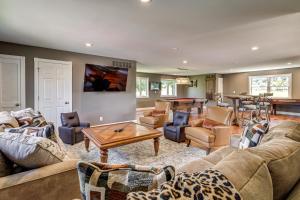 a living room with couches and a table at Gated 35-Acre De Soto Estate Pool, Lake and Patio! in De Soto