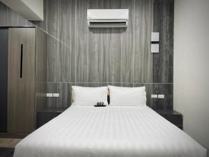 Postel nebo postele na pokoji v ubytování Shigang Homestay市港行旅