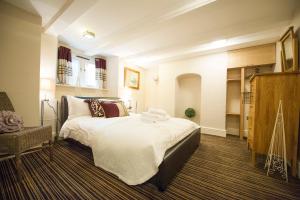 a bedroom with a large bed in a room at Chester Apartments in Chester