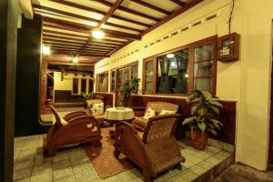 Χώρος καθιστικού στο Griya Langen Guesthouse