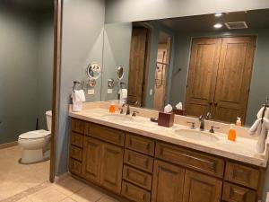 a bathroom with a sink and a toilet and a mirror at Bella Sirena in La Choya +23 photos