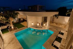 an overhead view of a swimming pool at night at Prava in Yonaha