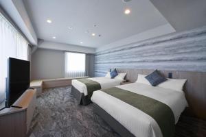 Katil atau katil-katil dalam bilik di Hotel Villa Fontaine Tokyo-Otemachi