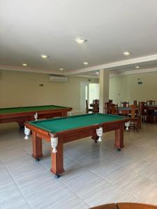 a room with two ping pong tables in it at Arraial do Cabo RJ - Golden Lake in Arraial do Cabo