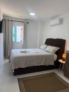 a bedroom with a large bed and a window at Arraial do Cabo RJ - Golden Lake in Arraial do Cabo +51 photos