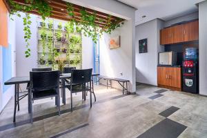 a dining room with a table and chairs at Bale Resident in Jakarta