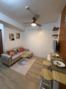 a living room with a couch and a table at Willow Nest in Bacolod